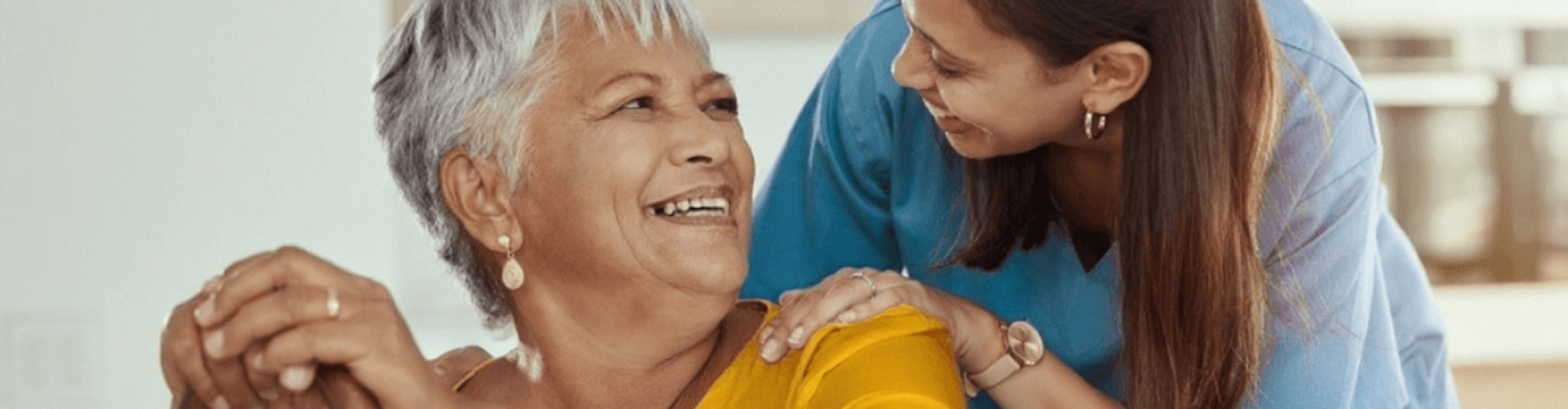 elderly woman with female caregiver